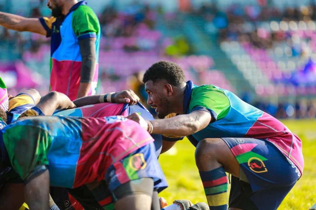 Rugby players packing down for a scrum during a match