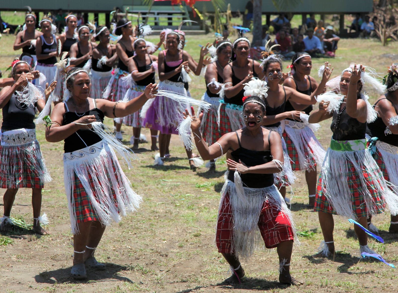 Women from Wairavanua community dancing in traditional dress at the opening of a new school building
