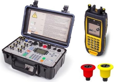 An Orica electronic blasting control unit in a hard case beside a handheld tester and two connector plugs