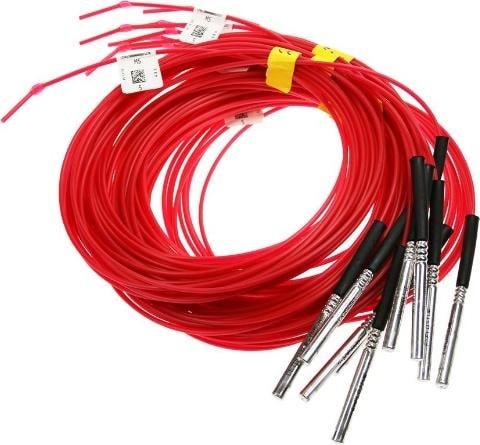 Coils of red Orica Exel shock tube, each terminating in a metal downhole detonator
